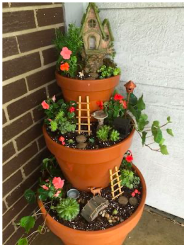 diy--sp--tiered-terra-cotta-gardents-w-succulentss--sourceunknown.png